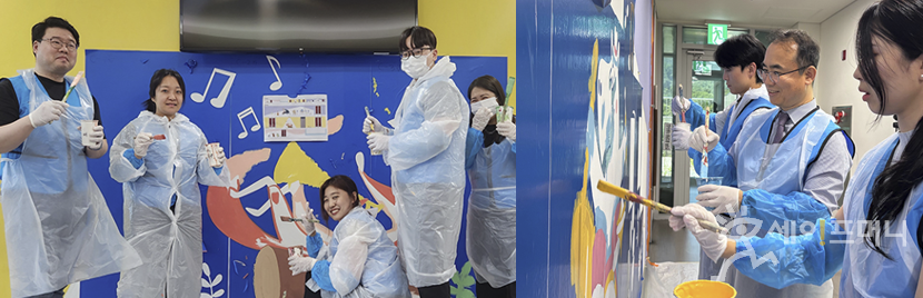 ▲ 청호나이스 관계자들이 서울 어린이병원 복도에 동화적 상상력이 어우러진 벽화를 그리고 있다. ⓒ  청호나이스